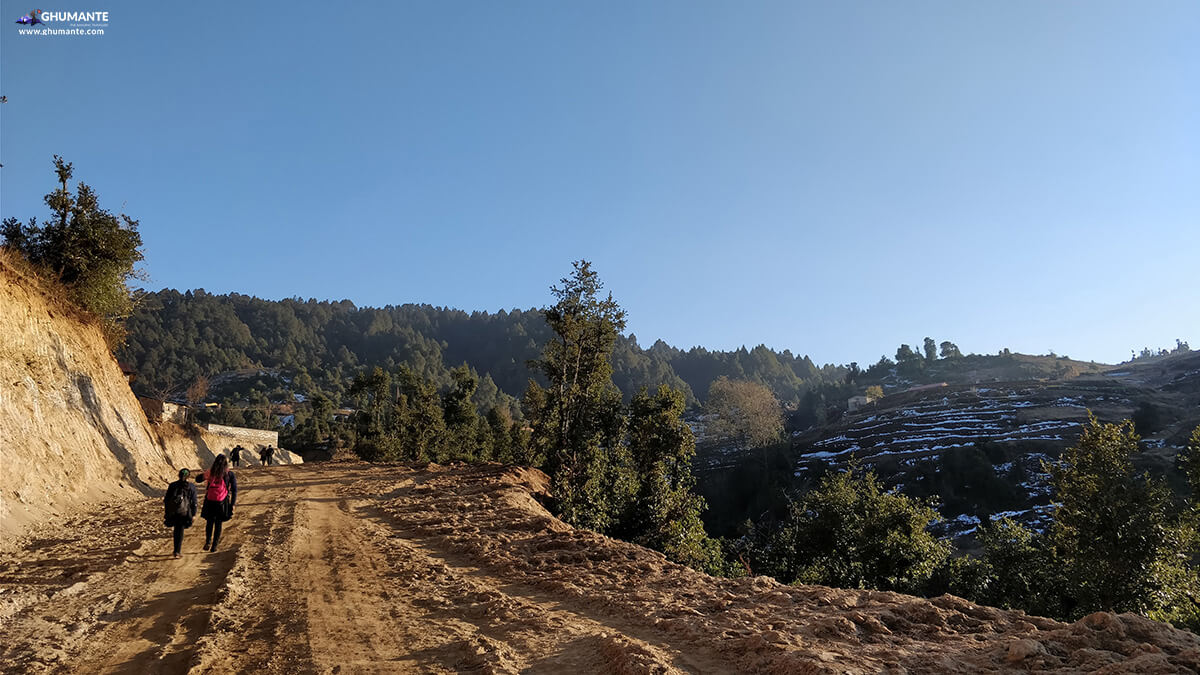 School children return home through the under construction motor roads at Dhunge Bajar. This road goes to Shailung.